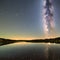 A starry night sky with a prominent Milky Way over a calm, reflective lake3, Generative AI