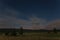 Starry sky with clouds in the Cansiglio forest