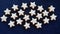 Starry sky. Many home-baked cinnamon stars  in front of dark blue background.