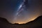 Starry sky and Milky Way arc, with details of its colorful core, outstandingly bright, captured from the Namib desert in Namibia,