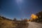 Starry sky, Milky Way arc and moon, captured from the Kalahari Desert in Botswana, Africa. Moonlight illuminating the landscape an