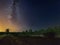 Starry sky with Milky Way galaxy over the summer night rural landscape