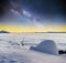 Starry sky and the Milky Way a yurt in winter fog mountains