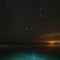 Starry sky over crack Baikal ice