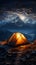 Starry summit camping Tent pitched high, immersed in mountainous nocturnal grandeur