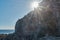 starry sun  on cliff  limestone rock  with blue sky  rockfall