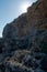 starry sun  on cliff  limestone rock  with blue sky  rockfall