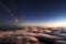 Stars above cumulus clouds in the rays of the setting sun