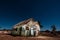 Stars above the moonlit rusty old church in Lightning Ridge Australia