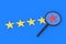 Stars of rating and magnifying glass. Search for a hotel, restaurant with a low rating