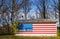 Stars and Stripes flag painted on a rural american house