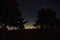 Stars between the trees and light pollution in a Wisconsin Cemetery.