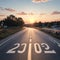 Start 2023 written on highway road in the middle of empty asphalt road of asphalt road at sunset.Concept of planning