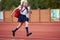 Start. Back to school, kids and education concept. Girl dressed in school uniform as elementary student carrying big