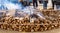 Start of big bonfire coming out smoke with wooden logs in a popular village festival for typical rural celebration and people