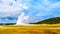 The start of an Eruption of the famous Old Faithful Geyser, a Cone Geyser in the Upper Geyser Basin, in Yellowstone National Park