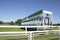 Start gate trailer for the horse race on a green grass track at