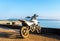 Start The Journey Concept, Old Small White Motorcycle with Blue Sea and Sky in Background