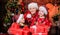 The start of the new year. Mother and daughters on Christmas day. Mother and children with Christmas gifts. Happy family