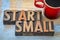 Start small banner in wood type