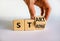 Start strong symbol. Businessman turns wooden cubes with words `start strong`. Beautiful white background, copy space. Business