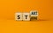 Start strong symbol. Turned wooden cubes with words `start strong`. Beautiful orange background, copy space. Business and start