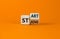 Start strong symbol. Turned wooden cubes with words `start strong`. Beautiful orange background, copy space. Business and start
