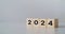 start to year 2024. wooden cube block with 2024 year text. happy new years concept