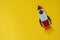 Start up business concept. Boost or increase incomes, salary. Drawn rocket on colorful yellow background. Copy space