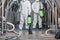 Start up, business and quarantine. Guys in protective suits work at factory and disinfect brewery kettles