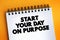 Start Your Day On Purpose text on notepad, concept background