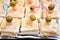 Starter food canape with tuna fish mayonnaise shrimps oliva appetizer food gourmet