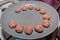 Starting the cooking of raw meatballs on a pan over the stove