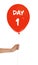 Starting new life chapter. Woman holding red balloon with text Day 1 on white background