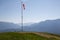 Starting point near Garmisch Partenkirchen of paragliders with red and white windsocks. In the background mountain peaks in the Ge