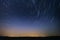Startrail landscape of moving stars in night sky