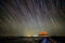 Startrail with wooden bridge and pavilion