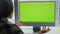 Startuper videocalling greenscreen computer office. Woman explaining video call