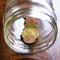 Stash of Greek euro coins in a jar