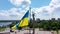 State flag of Ukraine at memorial complex. Blue and yellow color flag near monument on a bank of Dnieper river. Park of Glory