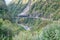 State High 76 passes Otira between bush clad steep hills and through protective tunnels
