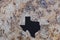 The state of Texas in stone