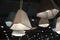 Statement pendant lapms with concrete plafonds hanging from the ceiling - good example of contemporary  scandinavian minima