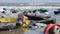 Static extreme close up of plastic garbage and trash on beach. Changing focus