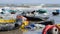 Static extreme close up of plastic garbage and trash on beach on sea background