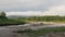 Static frame of the riverbed against the background of forest, fog and mountains