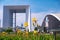 Static shot of blooming flower at La Defense business district in Paris with skyscrapers defocused on the background