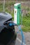 A static shot of a solid black Tesla Model 3 dual motor charging at the Sandefjord municipality AC