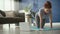 Static video of woman exercising on exercise mat