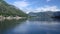 Static view of the Gulf of Kotor in Montenegro with a small motor boat coming towards the viewer